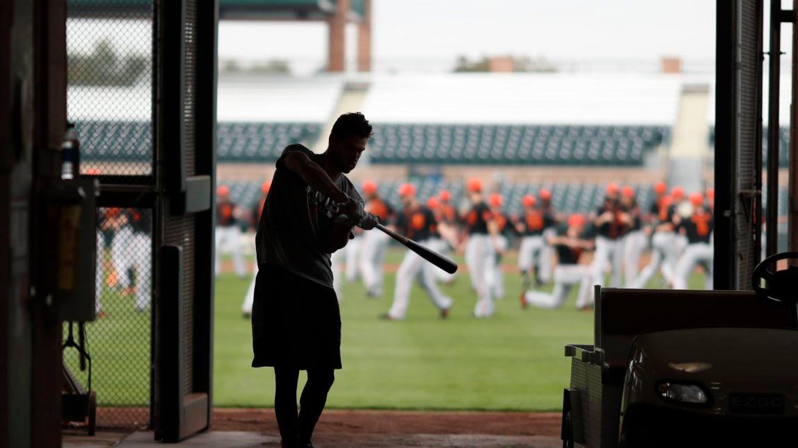 Why the Giants dugout at Scottsdale Stadium is overstuffed with players,  staff