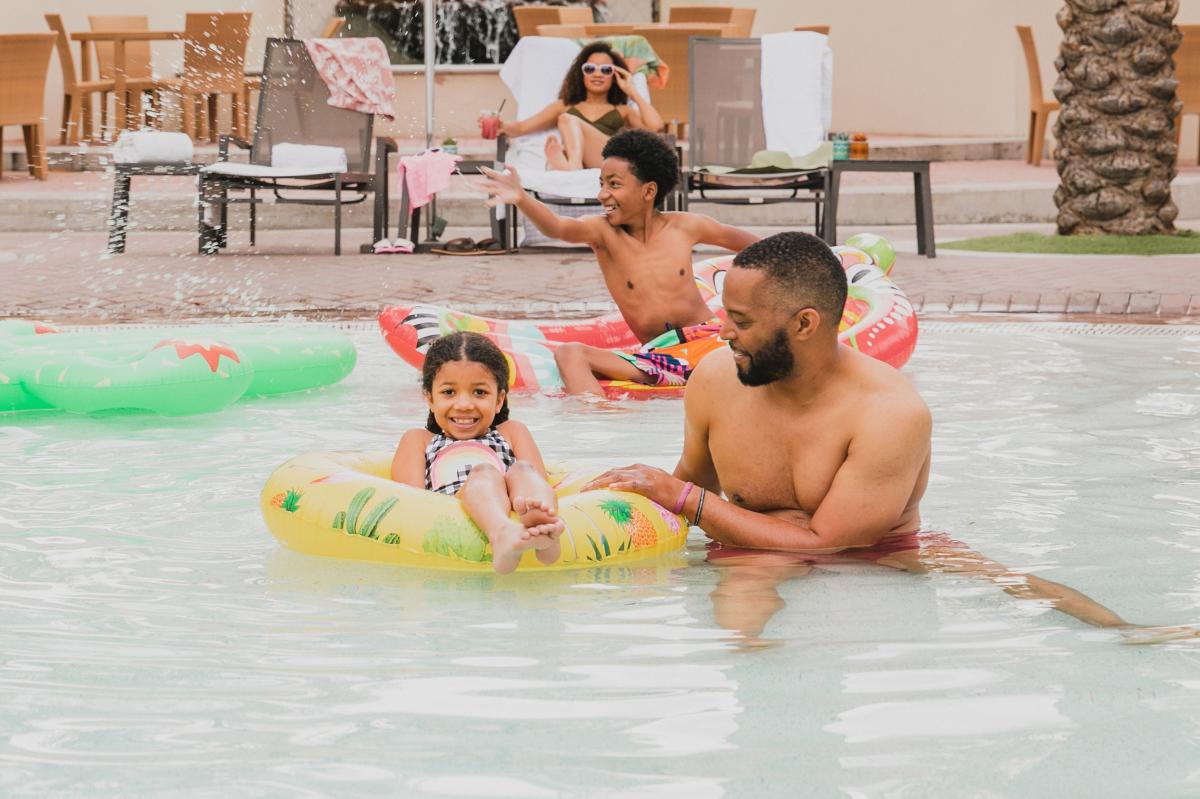 Family playing in Fairmont Scottsdale Princess pool