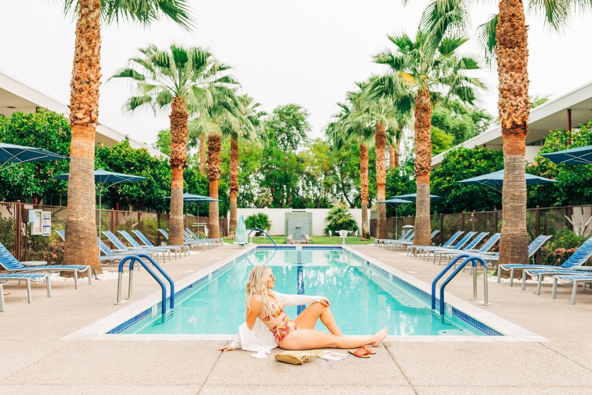 Woman sitting at Hotel Valley Ho Pool.