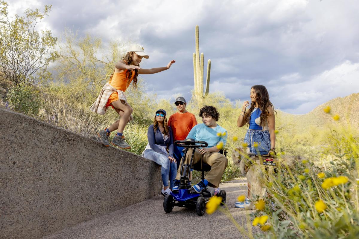 Hiking at Lost Dog Wash Trailhead on the barrier-free Kovach Family Nature Trail.