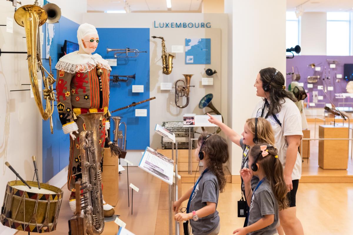 Family viewing an exhibit at the Musical Instrument Museum (MIM)
