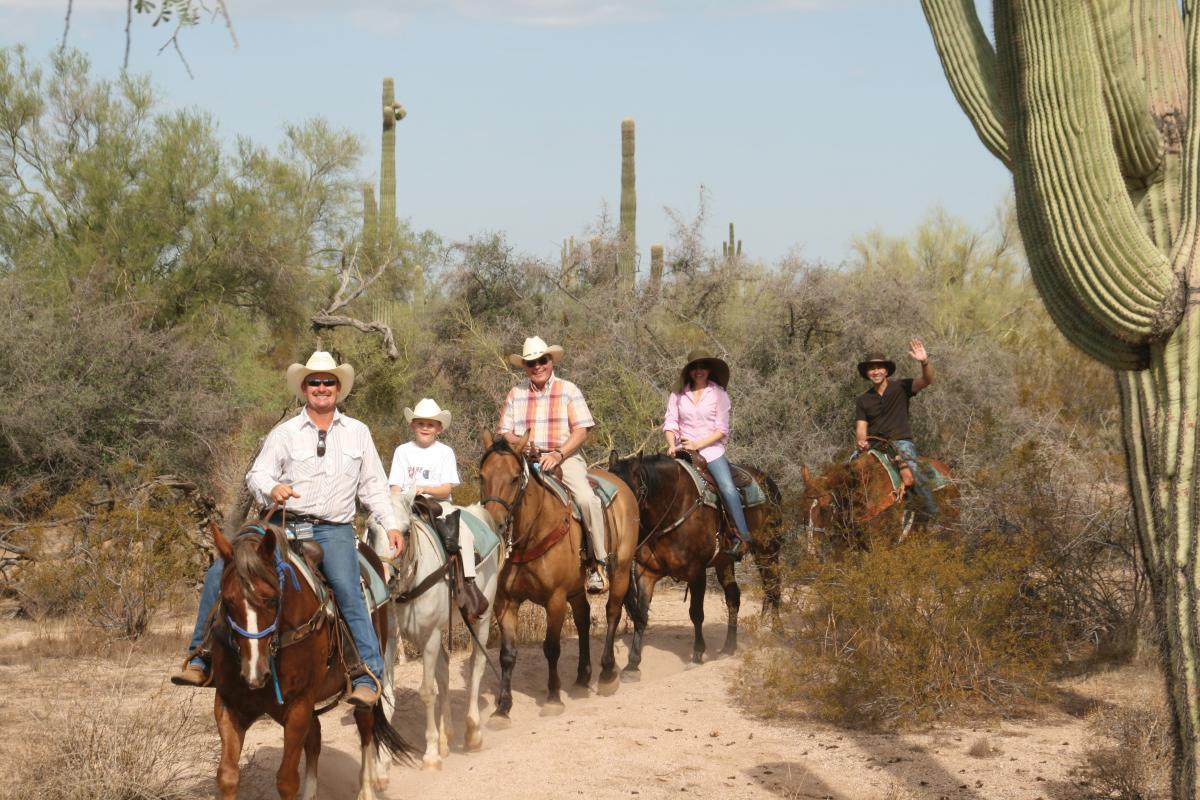 Group of people on a horseback riding trail in Arizona